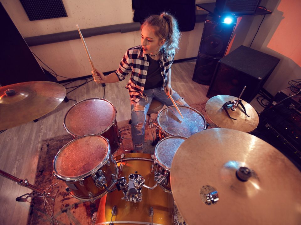 Young Woman Rocking Drums